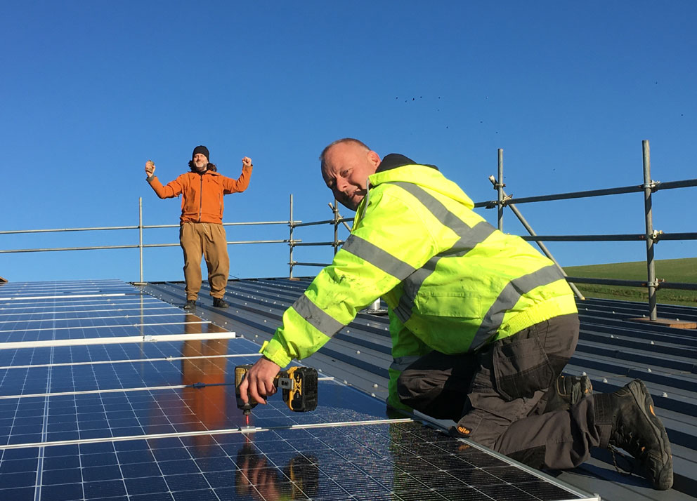 Will from BEC & Jason from GenFit installing solar panels at Rathfinny Wine Estate